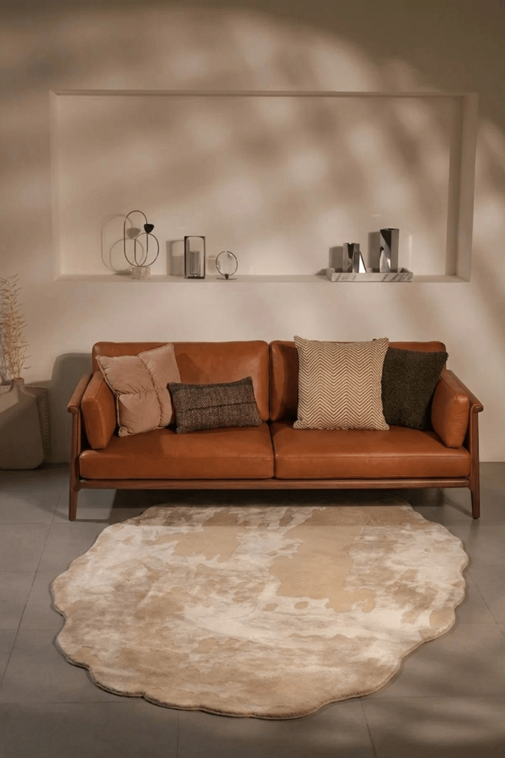 Suntrace runner rug placed beneath a modern leather sofa, creating a serene and inviting interior aesthetic.