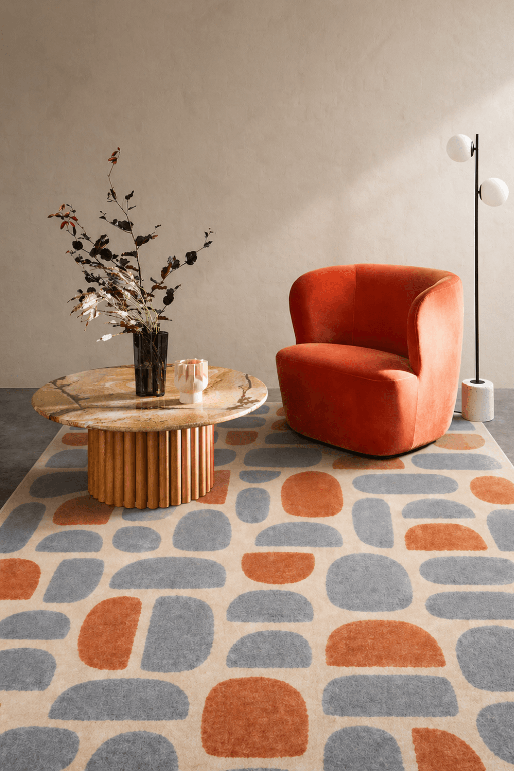 Pebble Harmony Hand-Tufted Wool Area Rug in slate blue and terracotta tones, enhancing a modern living room.