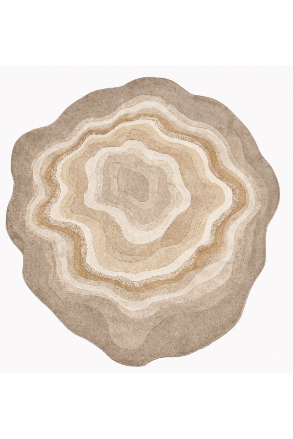 Desert sculpted rug showcasing an organic, fluid design with concentric layers of neutral colors.
