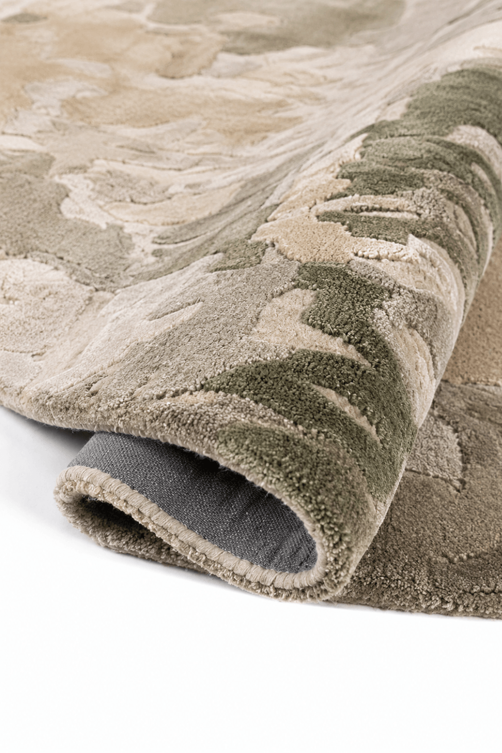 Close-up of the Nebula Sage abstract hand-tufted rug showcasing its unique texture and earthy tones.
