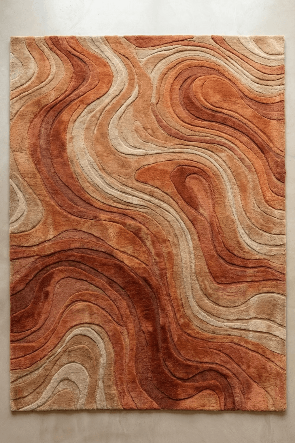 Textured Sandstone Botanica Scallop Rug featuring warm earthy tones and organic wave patterns.