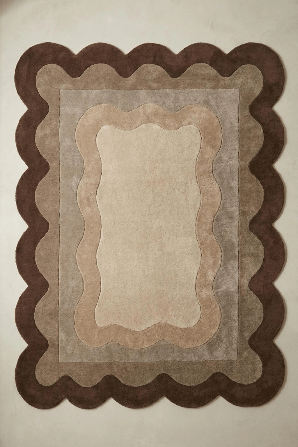 Cocoa scallop area rug featuring soft curves and layered tones, perfect for modern living spaces.