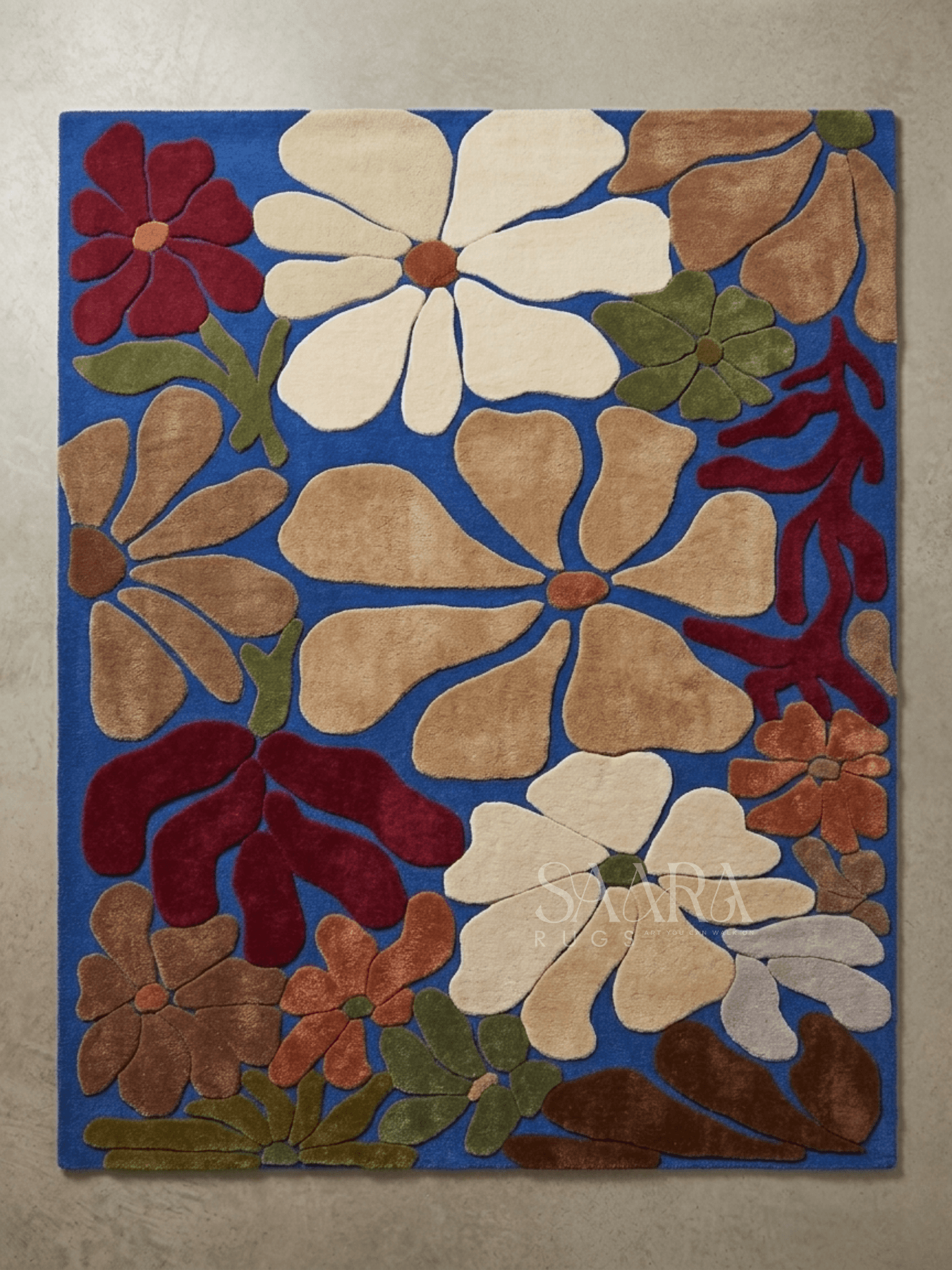 Stunning modern floral wool rug featuring bold blue base and oversized floral motifs in earthy tones.