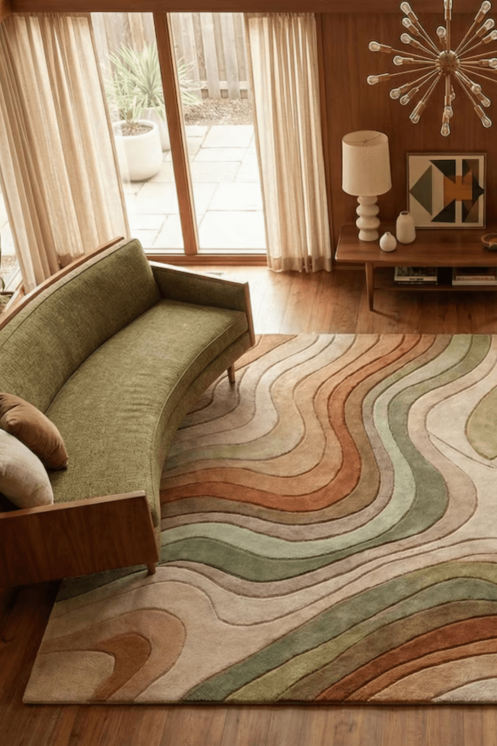 Sand Dune Contour Scallop Rug displayed in a modern living room, enhancing decor with its soft, flowing scalloped edges and tonal gradients.