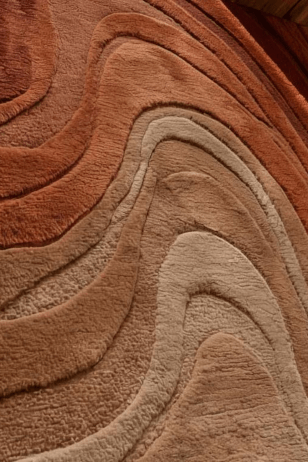 Close-up of the Sandstone Botanica Scallop Rug showcasing its rich textures and warm tones in a sculptural design.