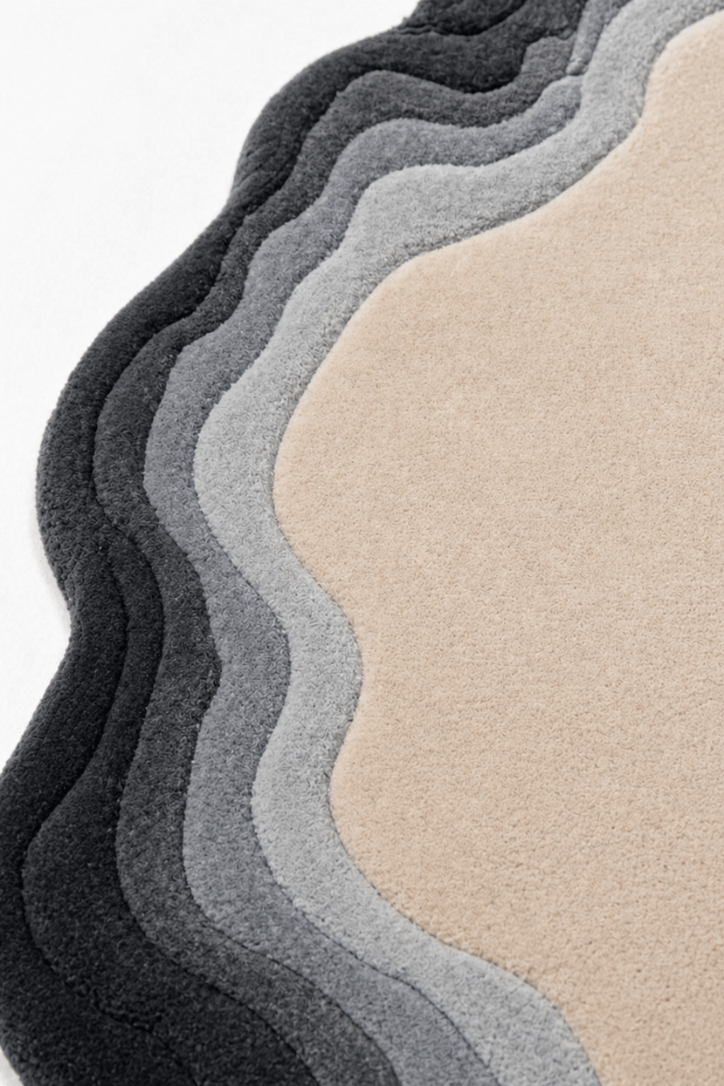 Close-up of the organic contour rug showcasing its layered contours and high-low pile texture.