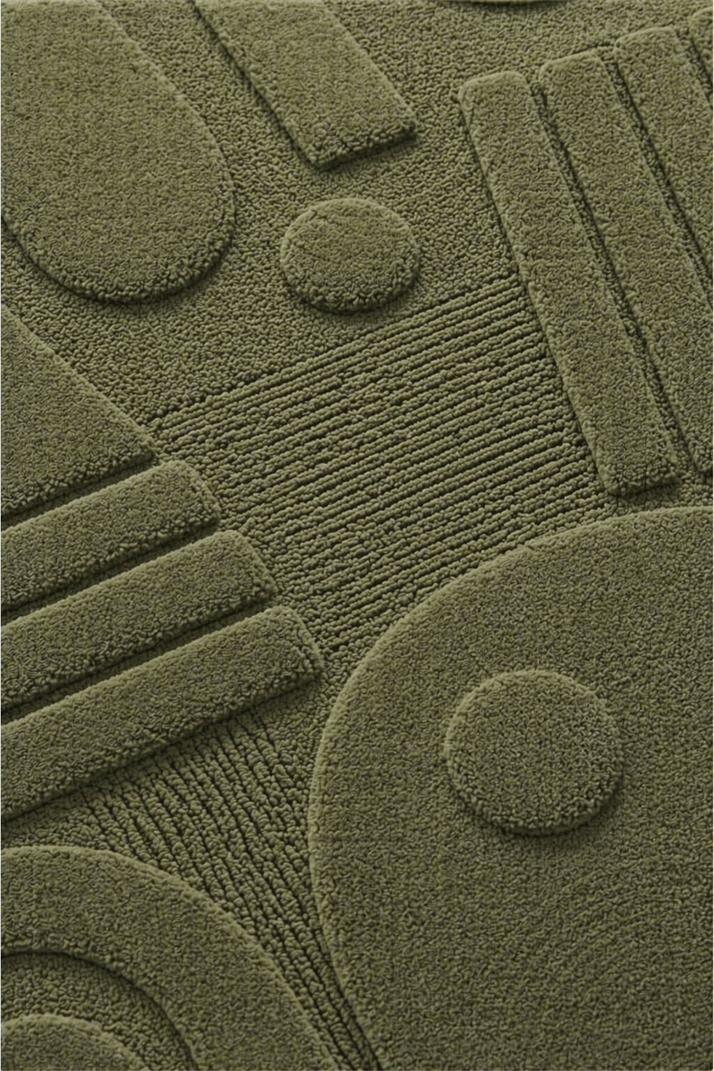 Close-up view of the moss geo-sculpt rug, showcasing its unique texture and tone-on-tone design in moss green.