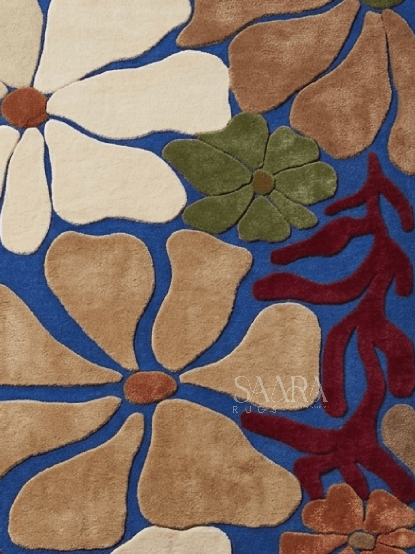 Modern floral wool rug featuring oversized floral motifs in blue and earthy tones.