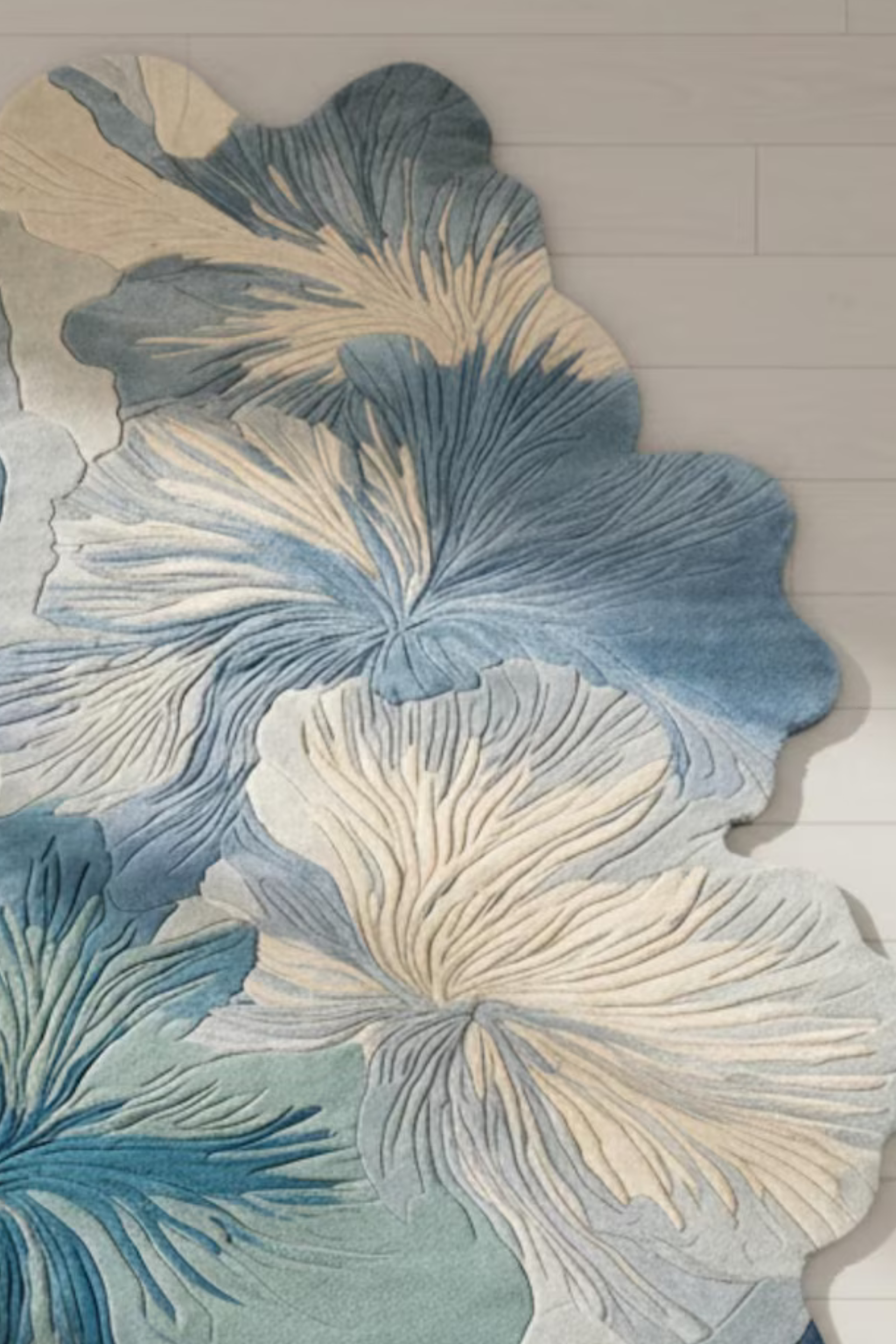 Ivora lines hand-tufted rug featuring floral patterns in blue and ivory tones, ideal for modern interior decor.