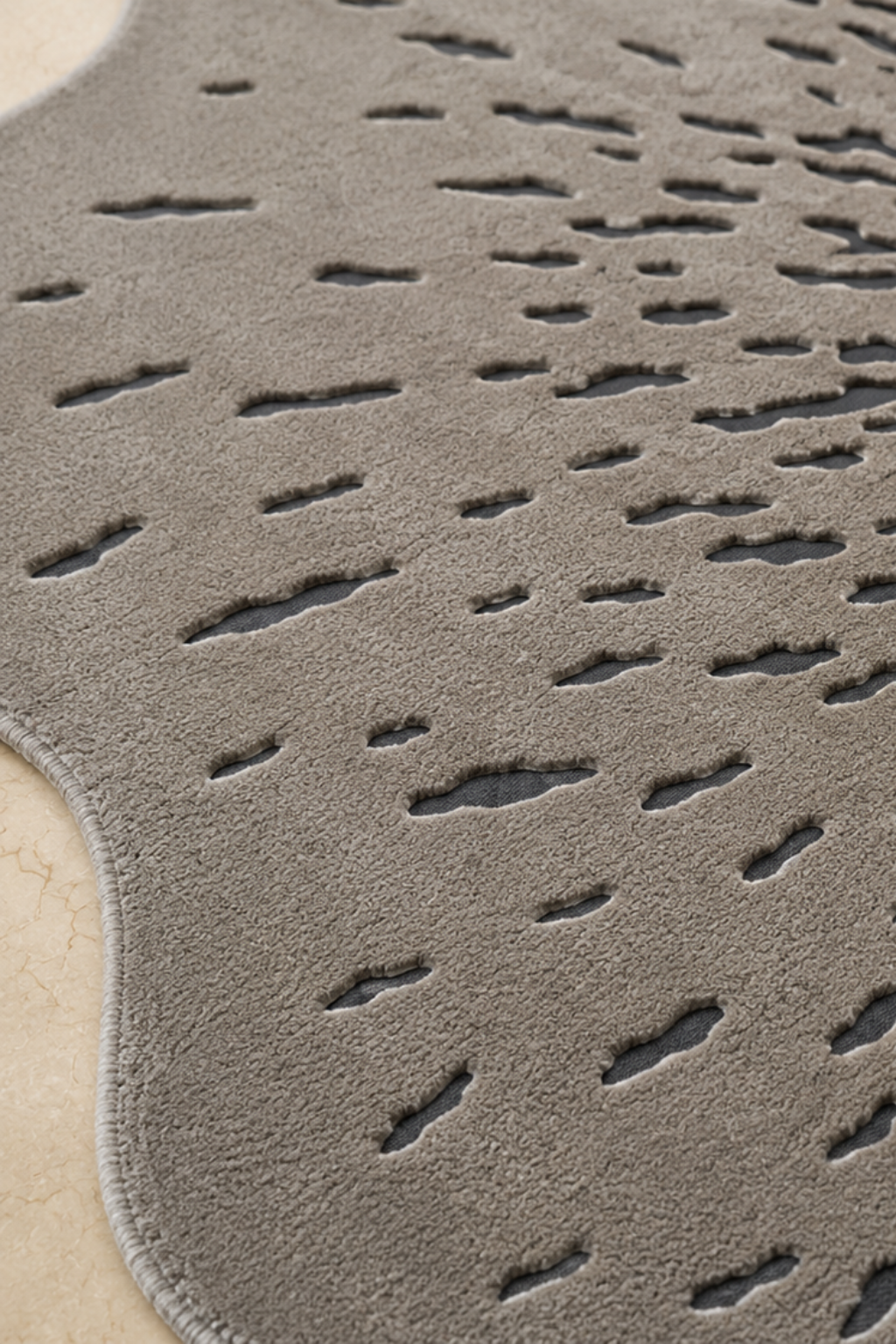 Luxury floral hand-tufted rug showcasing high-low texture and abstract design in soft neutral tones.