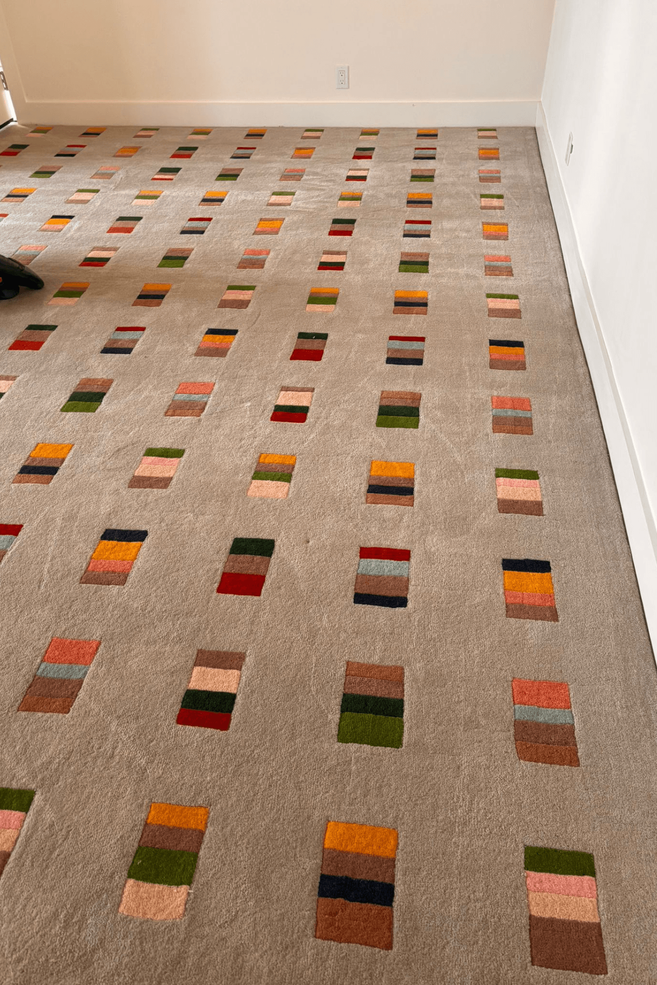 Mosaic Rhythm Rug showcasing geometric pattern area rug with multicolor block motifs on soft neutral base.