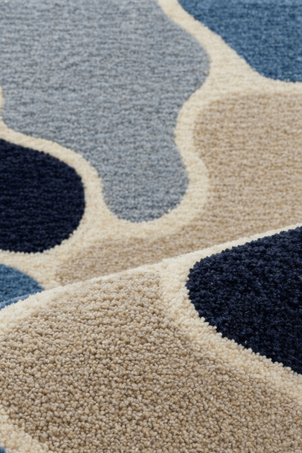 Close-up of the Azure Hive geometric abstract hand tufted rug featuring irregular hexagonal shapes in calming colors.