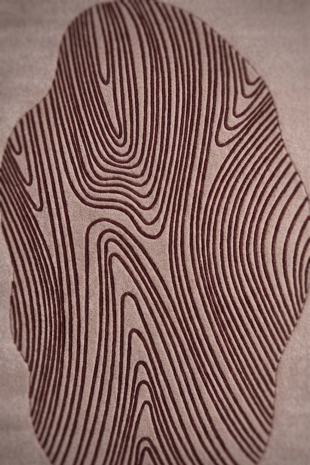 Artistic design with deep burgundy linework on a neutral base, showcasing an irregular area rug motif.