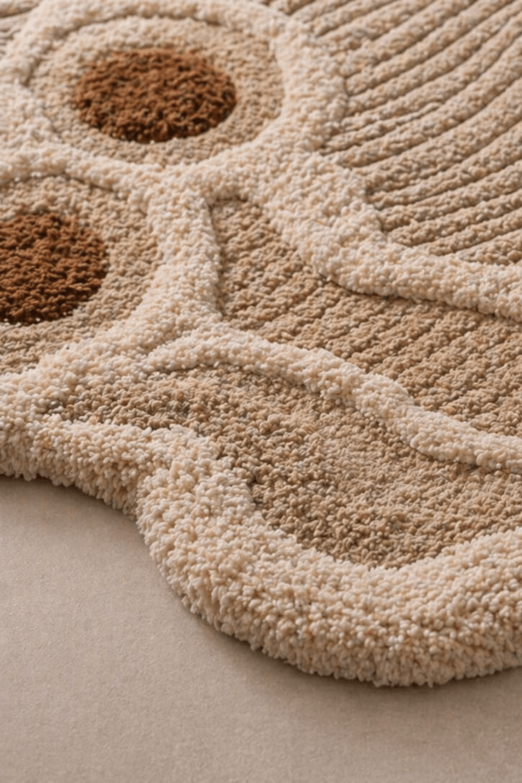 Close-up of the earthen contour rug showcasing its textured, organic design and warm neutral tones.