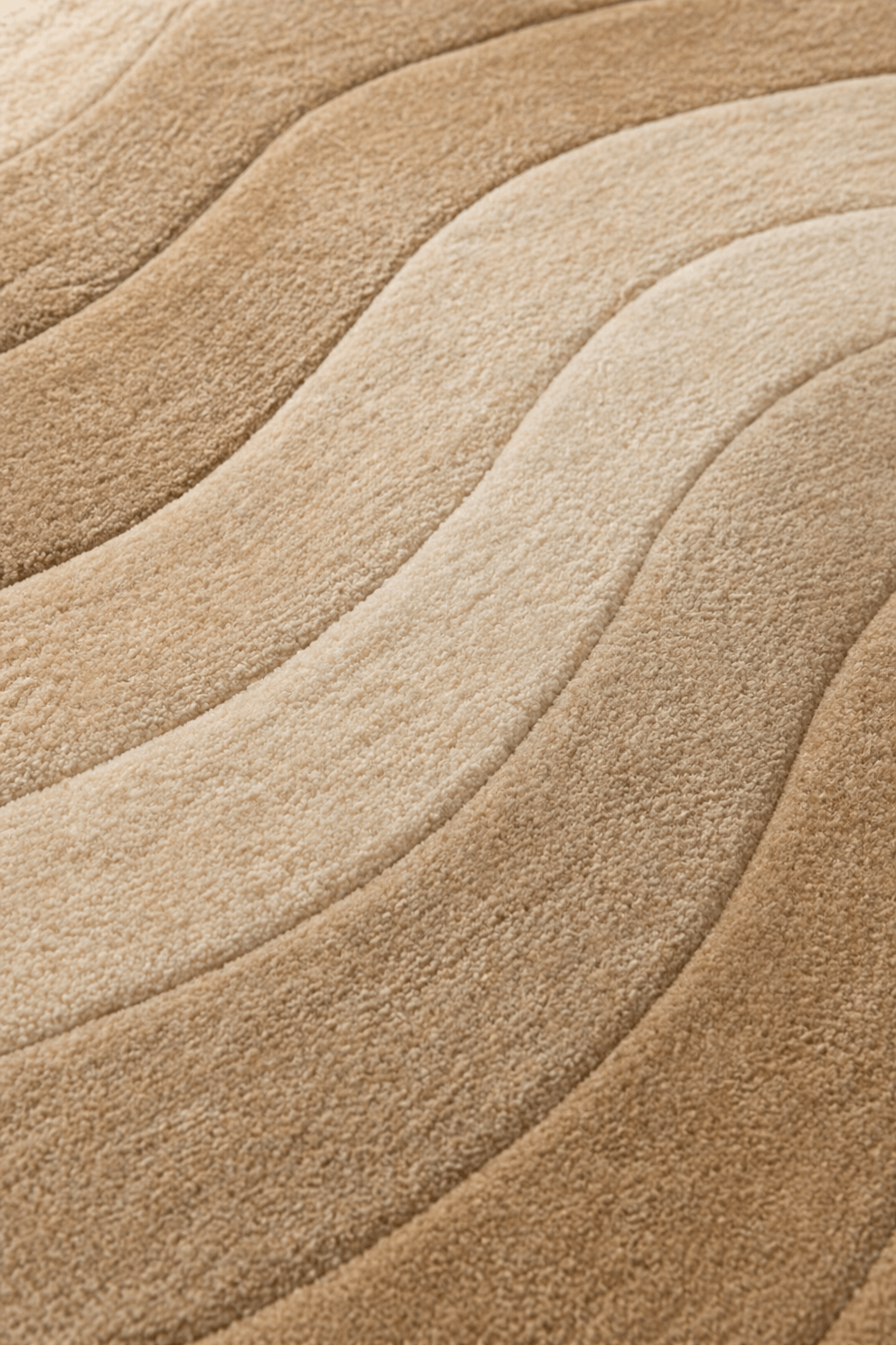 modern geometric rugs Dune Flow, close-up view of soft undulating lines in warm beige and sand tones.