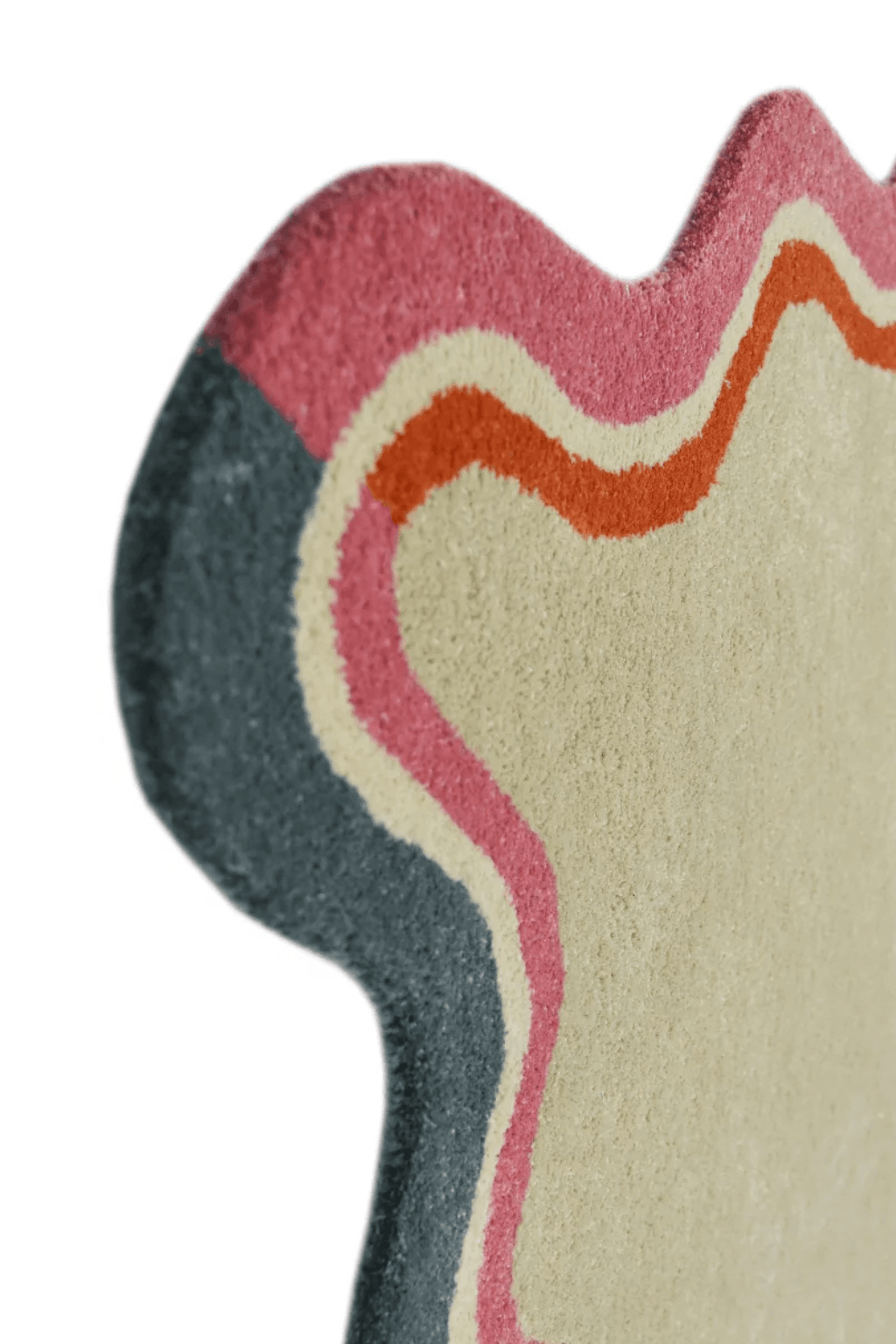 Scallop edge area rug in soft ivory with scalloped pink and multicolor wave border details.