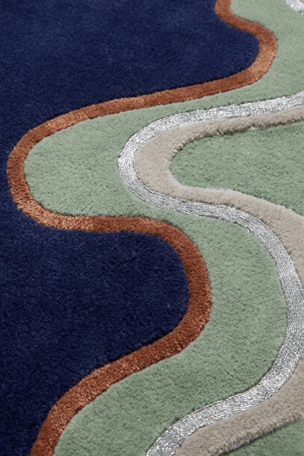 Close-up of the Azure Ambiance irregular hand-tufted rug showcasing its unique design and color interplay.
