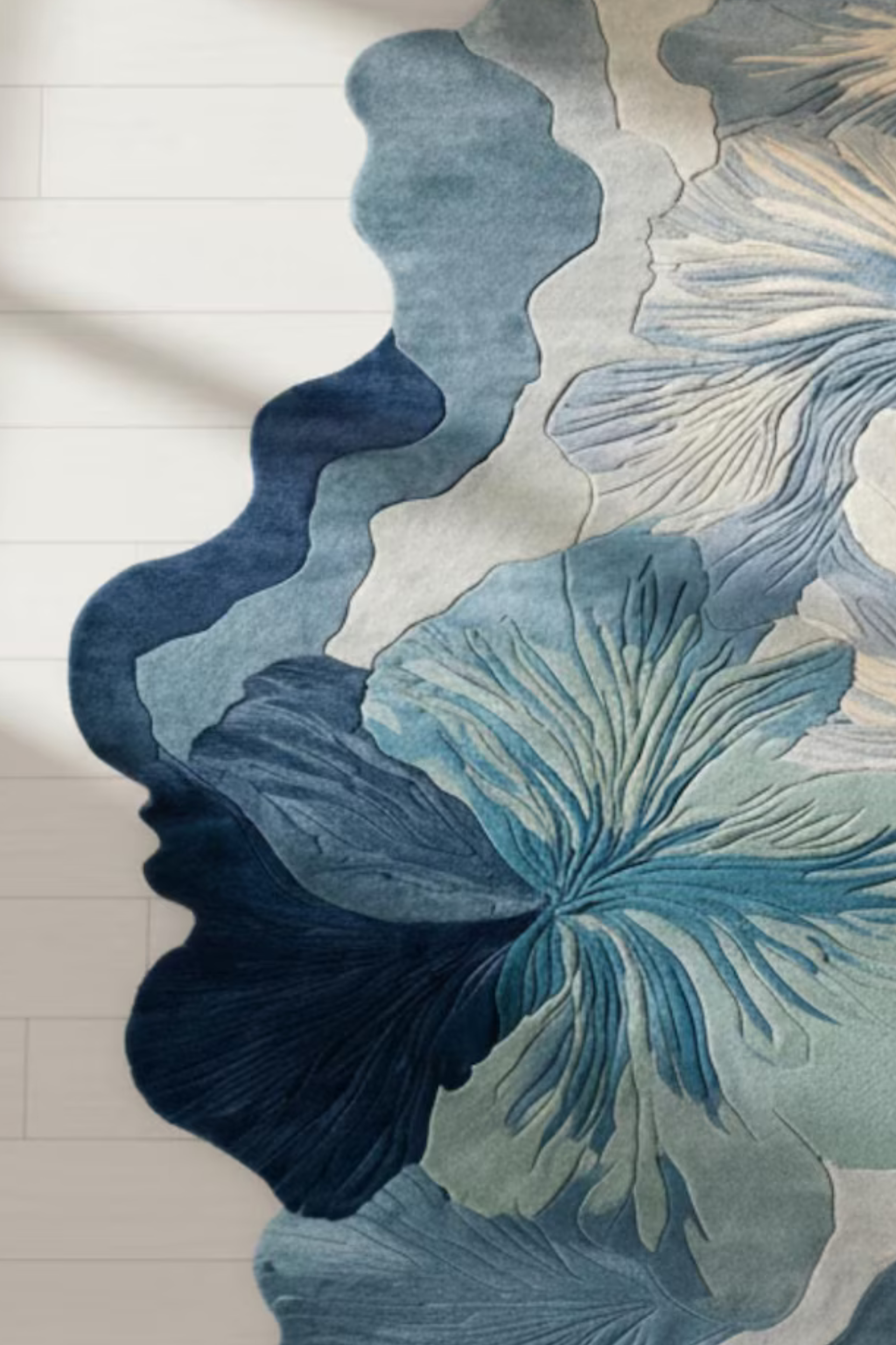 Ivora lines hand-tufted rug featuring intricate floral designs in blue and ivory tones for modern interiors.