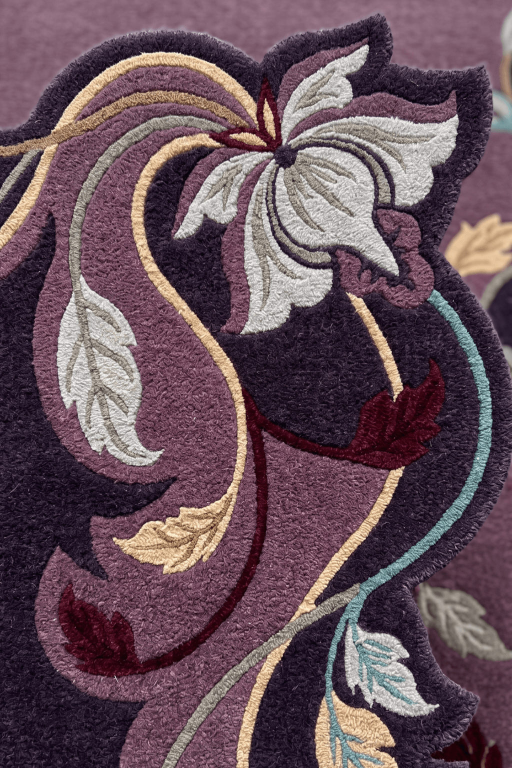 Luxurious floral majlis rug featuring intricate floral designs and rich deep-violet tones.
