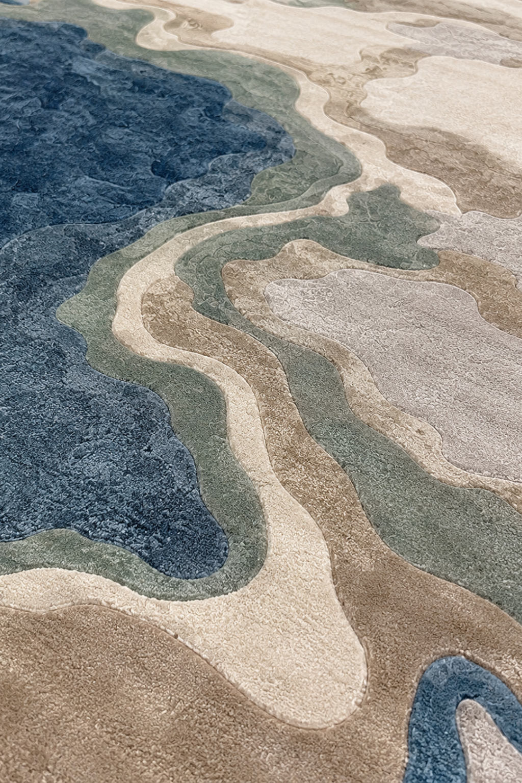 Coastal Strata Rug showcasing abstract contour design with blue, taupe, and stone hues, perfect for modern interiors.
