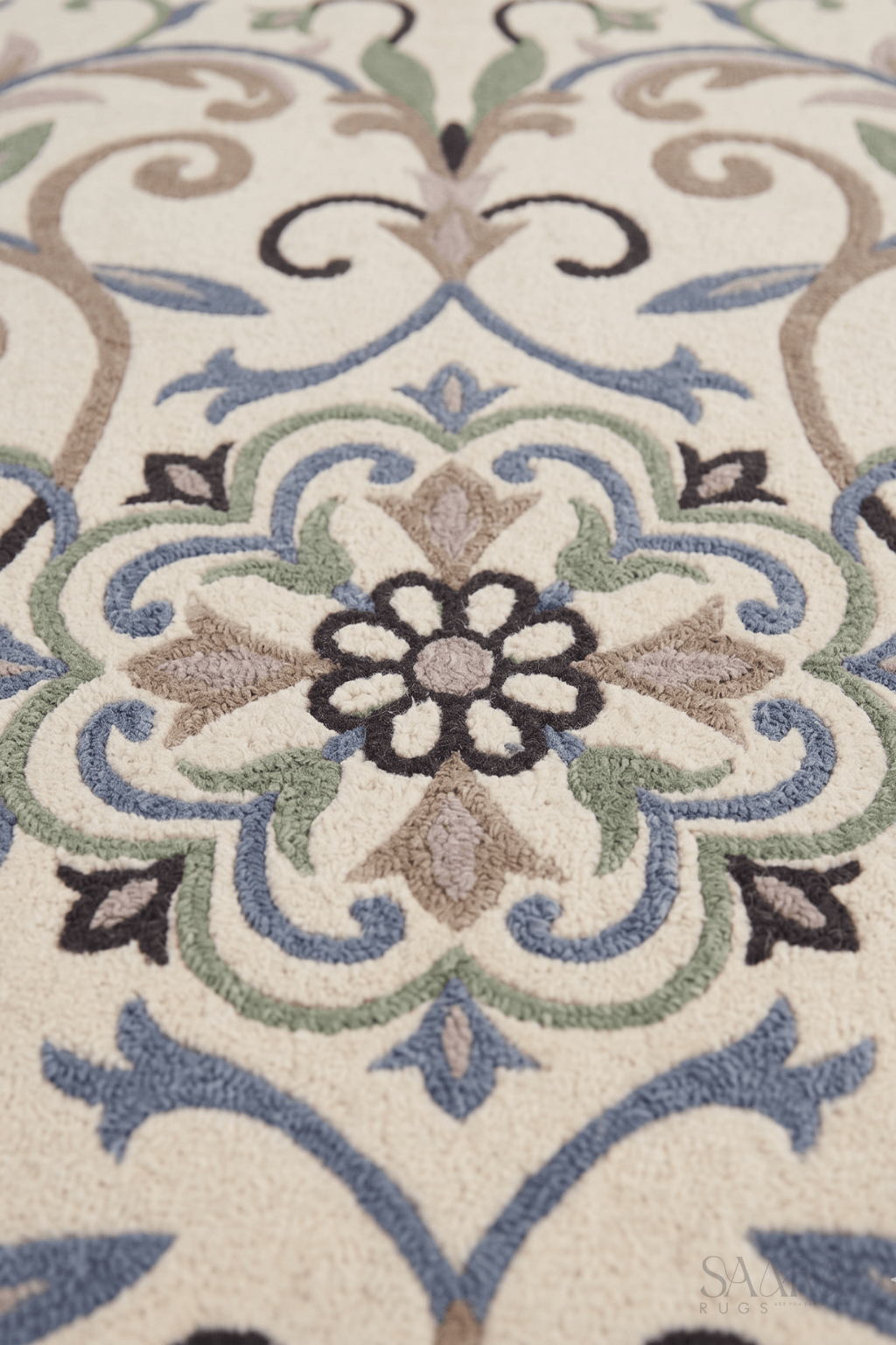 Close-up of the arabesque area rug showcasing a floral medallion and intricate botanical patterns.