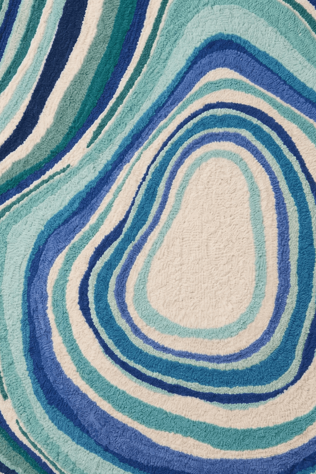 Close-up of azure stratum rug featuring swirling blue agate patterns in hues of blue and white.