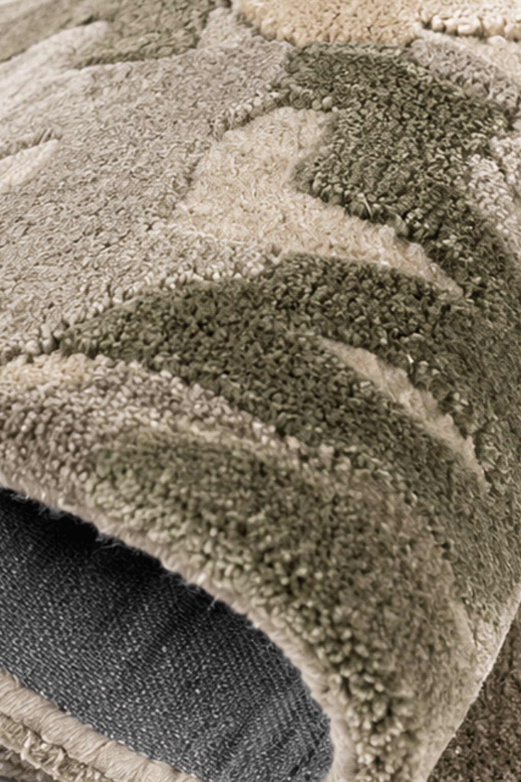 Close-up of the Nebula Sage abstract hand-tufted rug showing its plush texture and earthy tones.