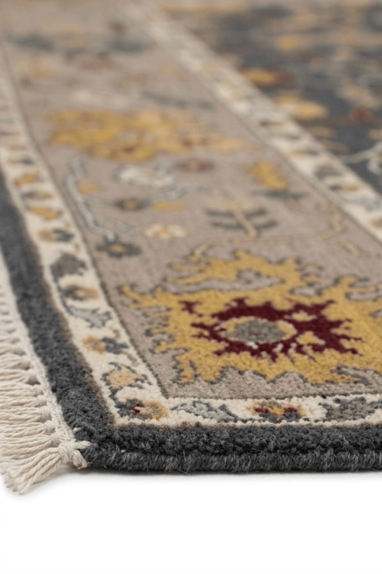 Hand-knotted oushak rug showcasing intricate designs in charcoal and ochre tones with a stylish border.