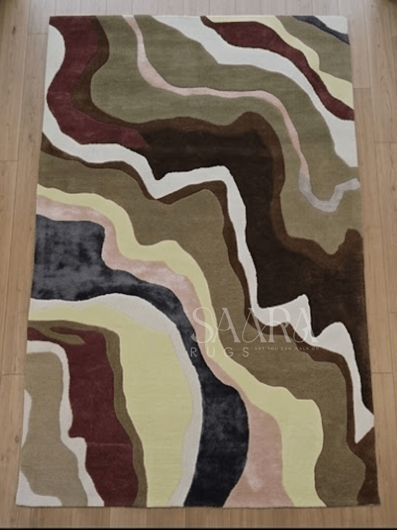 Abstract Earth Tone hand-tufted wool rug in earthy tones of olive green, blush, brown, and charcoal with an organic pattern.