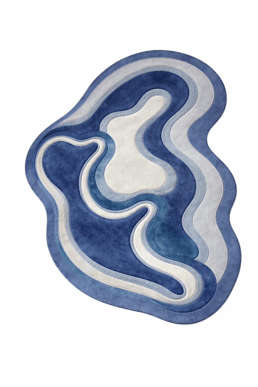 Azure contour rug designed in organic shapes with deep navy, misty blue, and soft ivory colors, evoking flowing water.