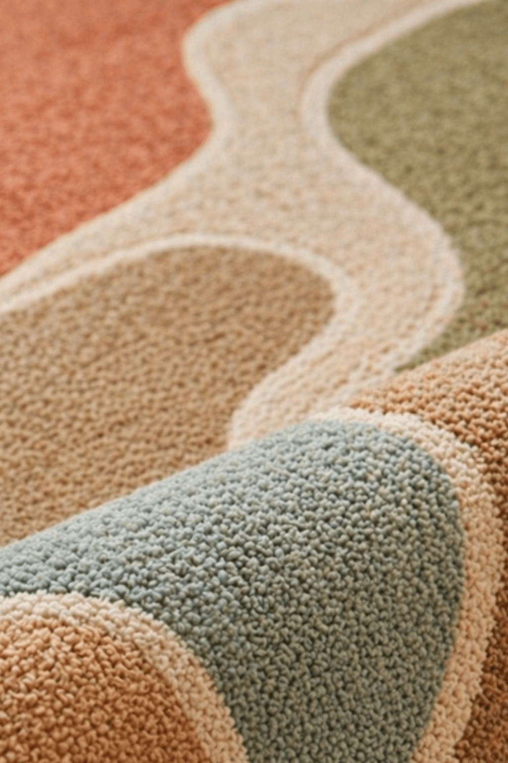 Close-up of the Elaris Flow organic hand tufted rug showcasing its abstract, earthy tones and sculptural contours.