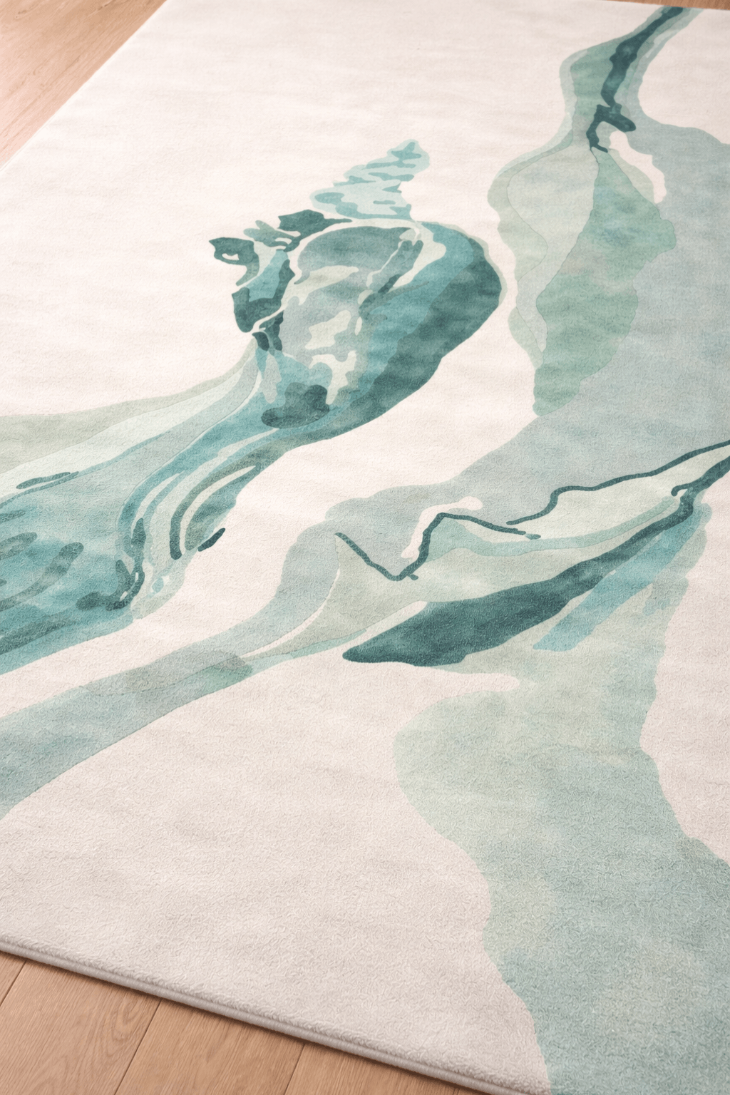 Abstract watercolor area rug featuring soothing aqua and teal shades on a calm neutral background.