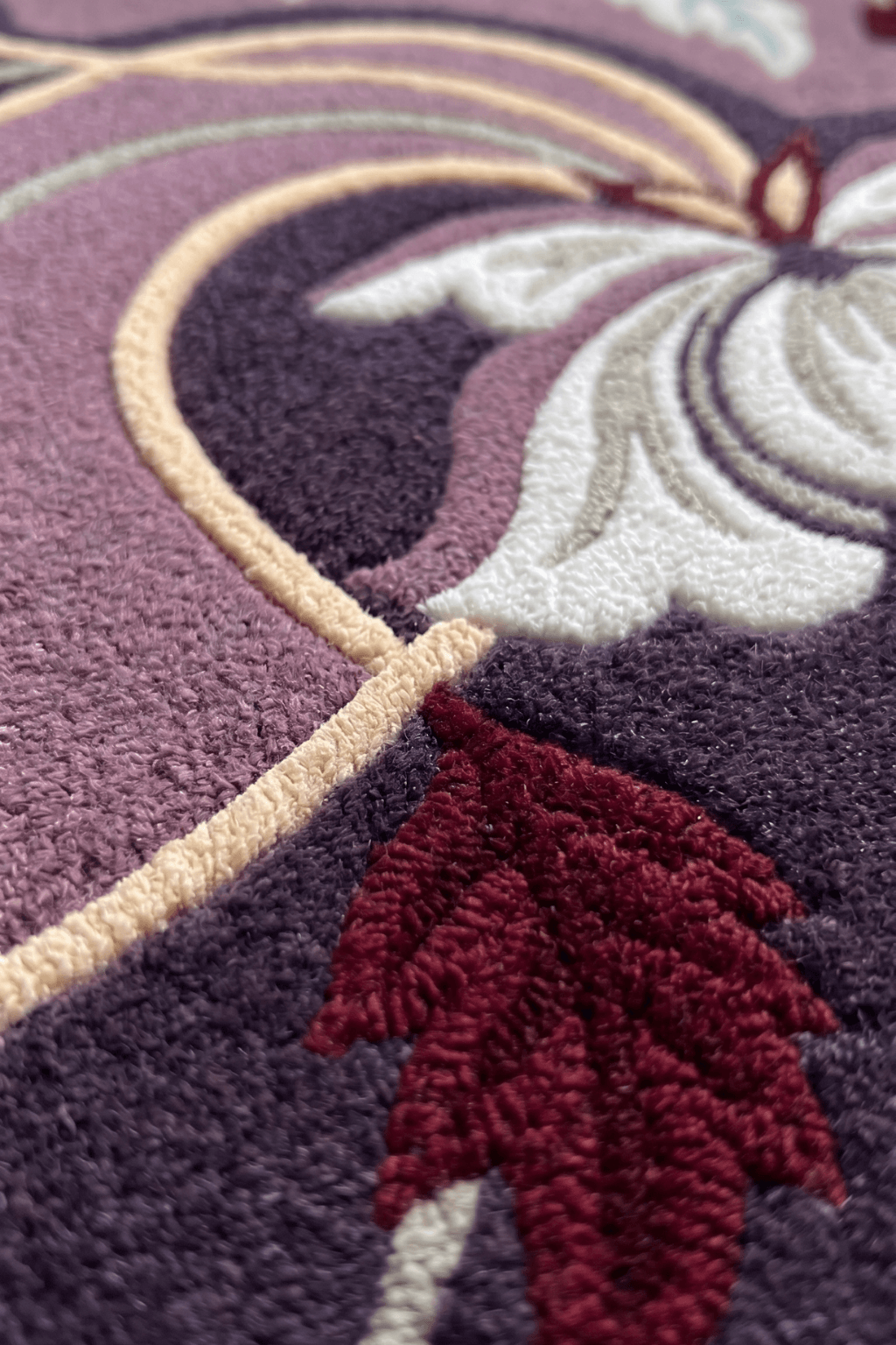 Close-up of the luxurious floral majlis rug showcasing intricate floral and leaf designs.
