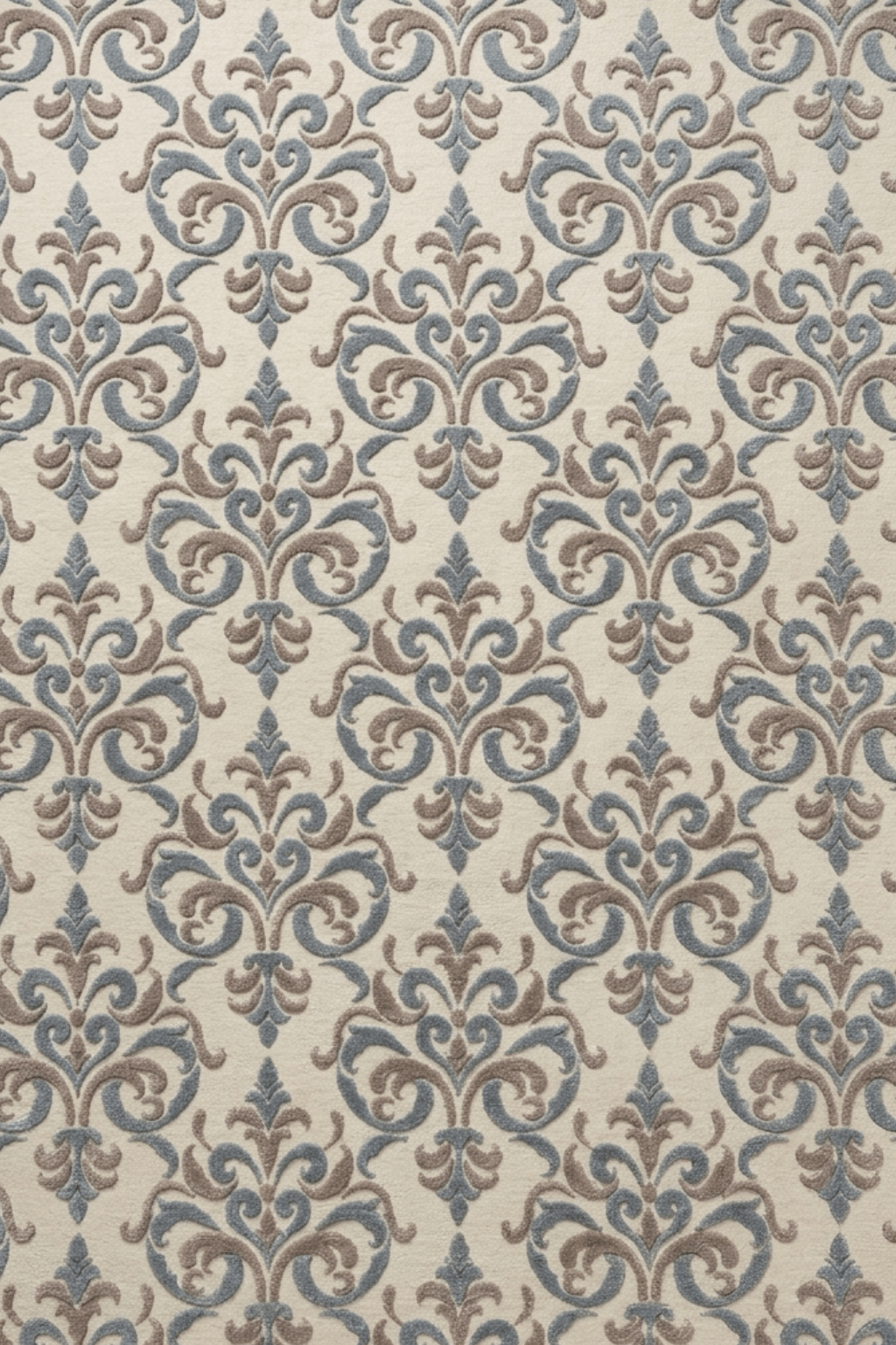 Fleur-de-Lis sculpted medallion rug featuring intricate patterns in slate blue and taupe on a soft cream background.