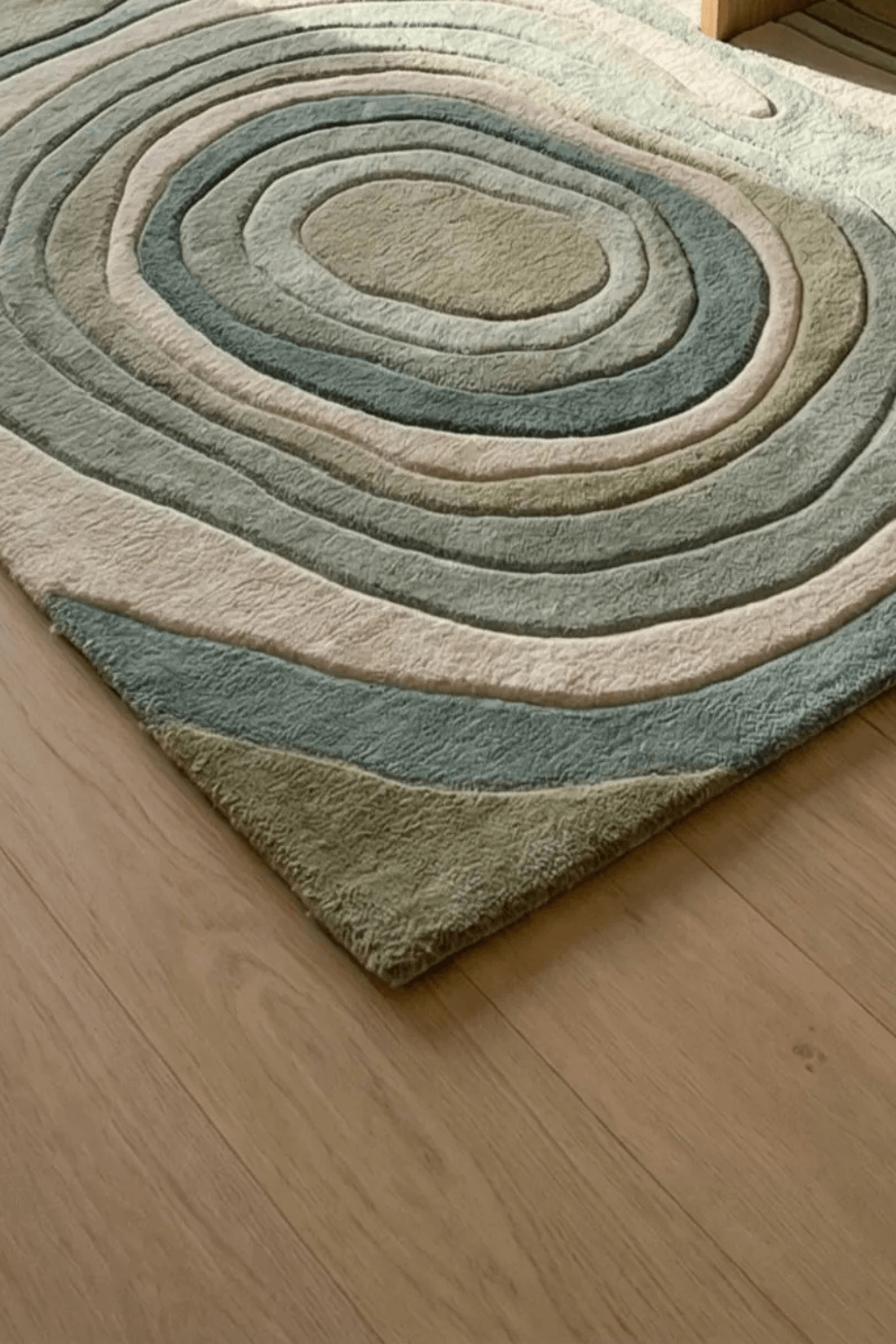Verdant Contour Flow Rug featuring soft sage, olive, and ivory tones with sculpted high-low contours.
