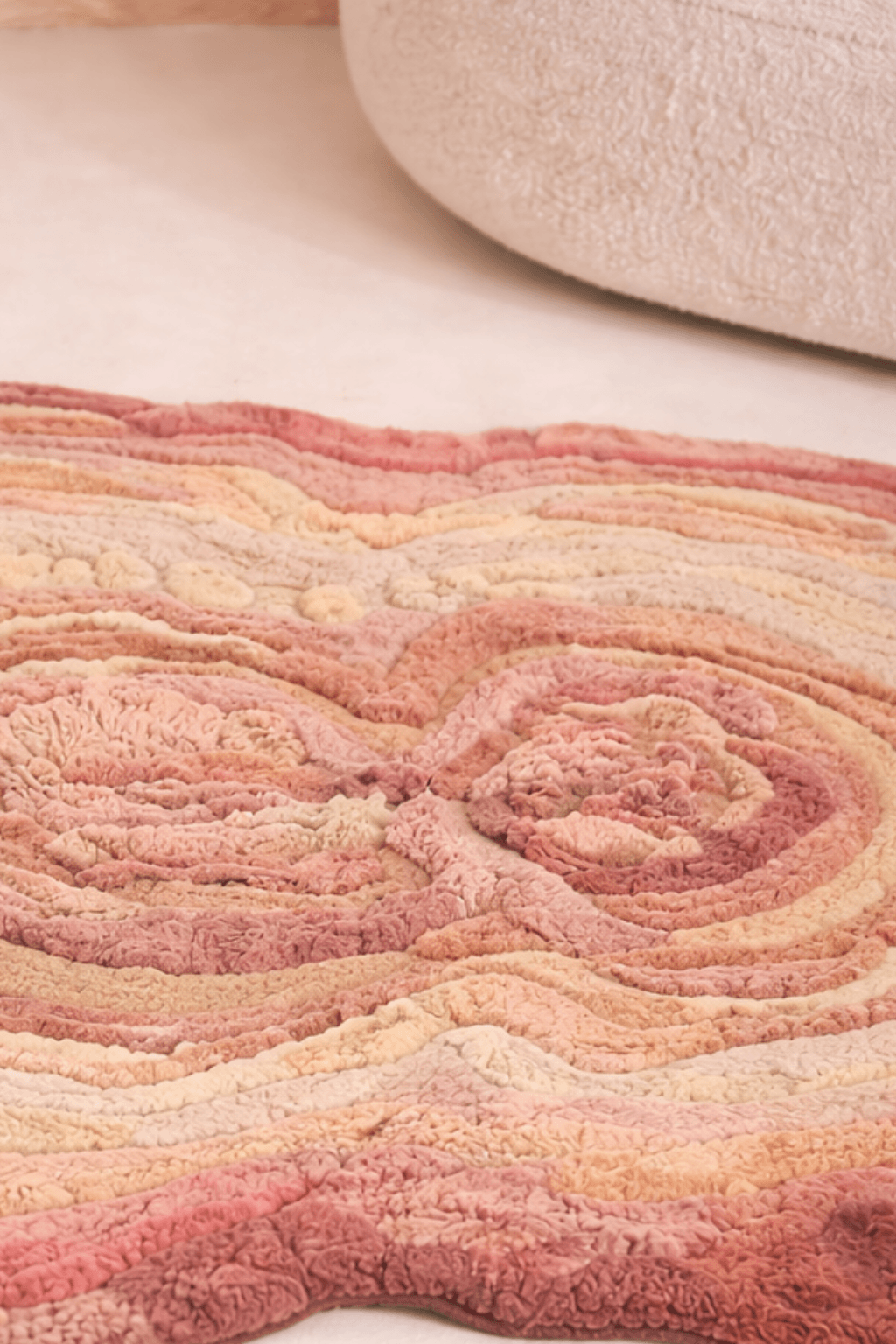 Blush Terrain Organic Rug featuring soothing shades of blush, coral, peach, and soft beige in a handcrafted design.