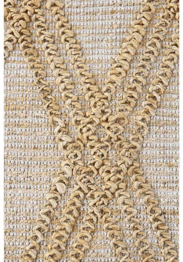 Close-up view of the intricate woven pattern of the Trellis Jute Rug, showcasing its elegant design and texture.