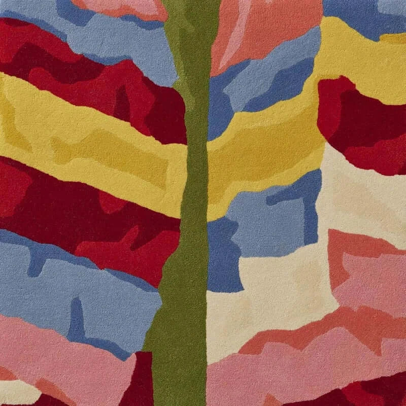 Colorful hand-tufted rug featuring a vibrant patchwork design inspired by Korean Saekdong traditions.