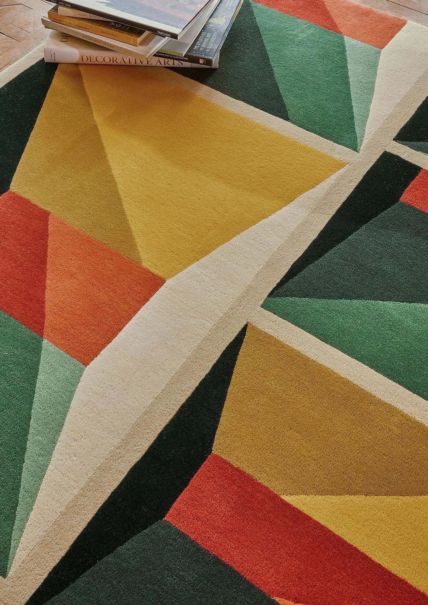 Facet Mirage Hand-Tufted Rug showcasing bold geometric patterns and vibrant colors, crafted from plush New Zealand wool.