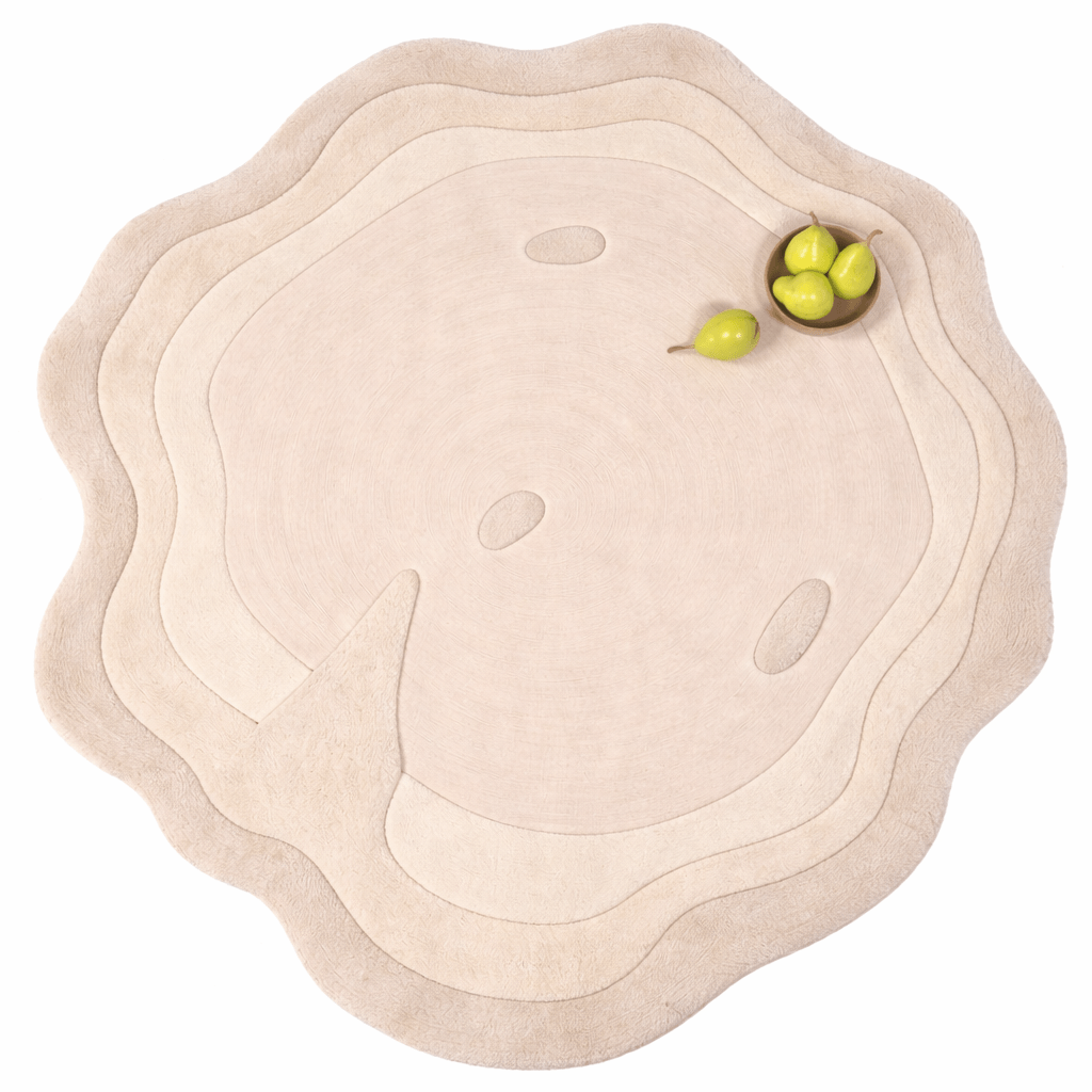 Crescent Calm hand-tufted wool rug showcasing fluid, organic shape and textures, perfect for modern minimalist spaces.