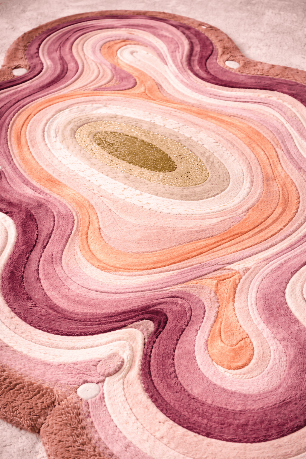 Cloudrest – Sculpted Wool Rug with a soft, contoured surface in pink and purple tones.