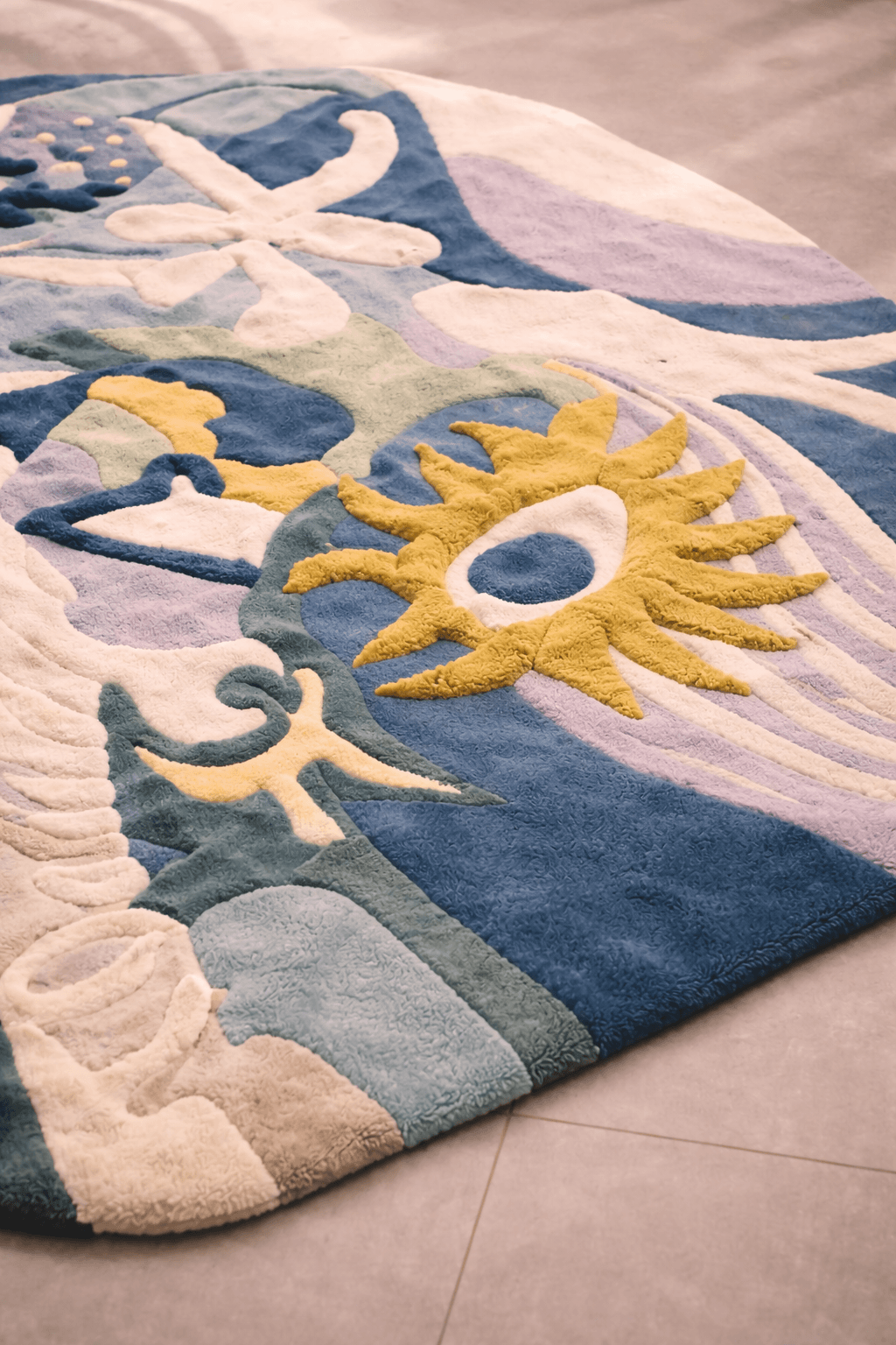Celestial Terra – Abstract Art Hand-Tufted Rug with organic shapes and sun motifs in calming colors.