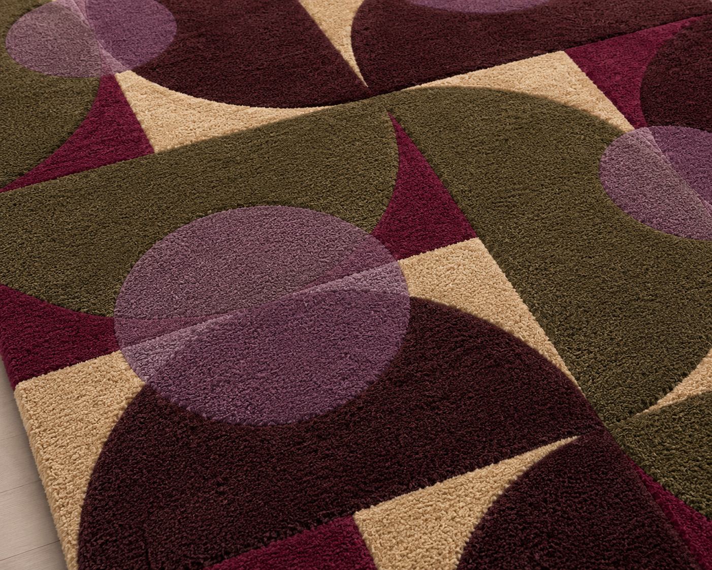 Luna Mosaic Area Rug featuring geometric patterns in deep burgundy and olive green hues.