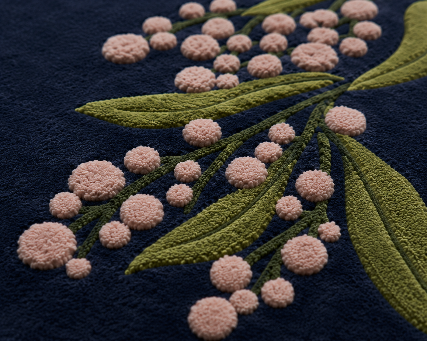 Close-up of the Midnight Berry Bloom Rug featuring pink berry accents and olive-green foliage on a midnight navy background.