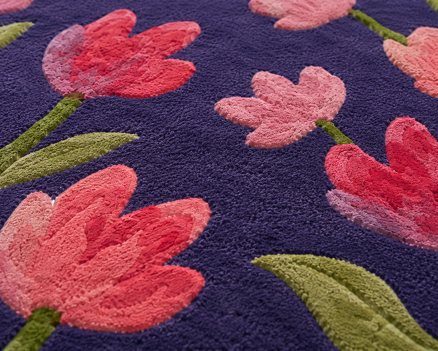 Violet Blossom Rug with pink and raspberry blooms on a rich violet background, showcasing floral artistry.