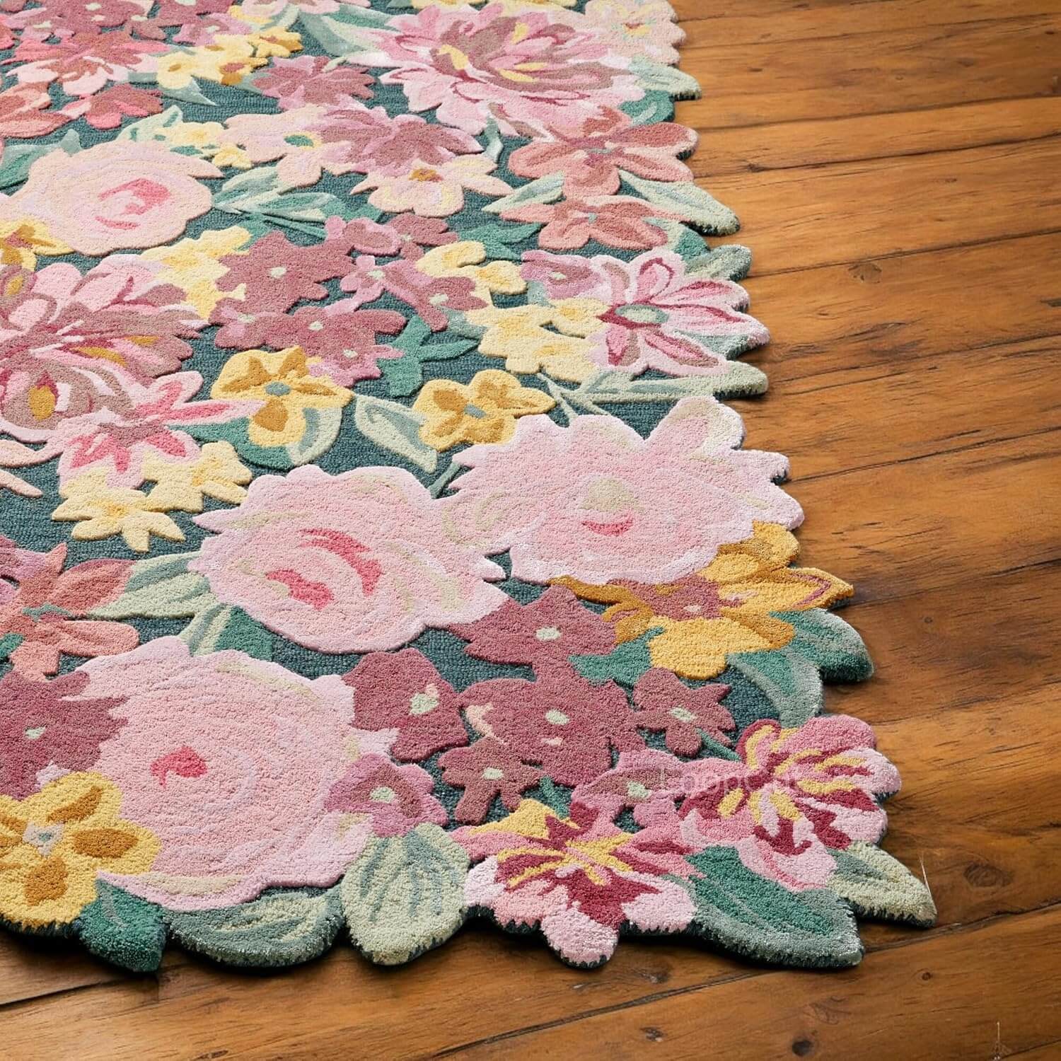Colorful Blossom Garden sculpted floral rug with intricate flower motifs and a textured design on wooden floor.