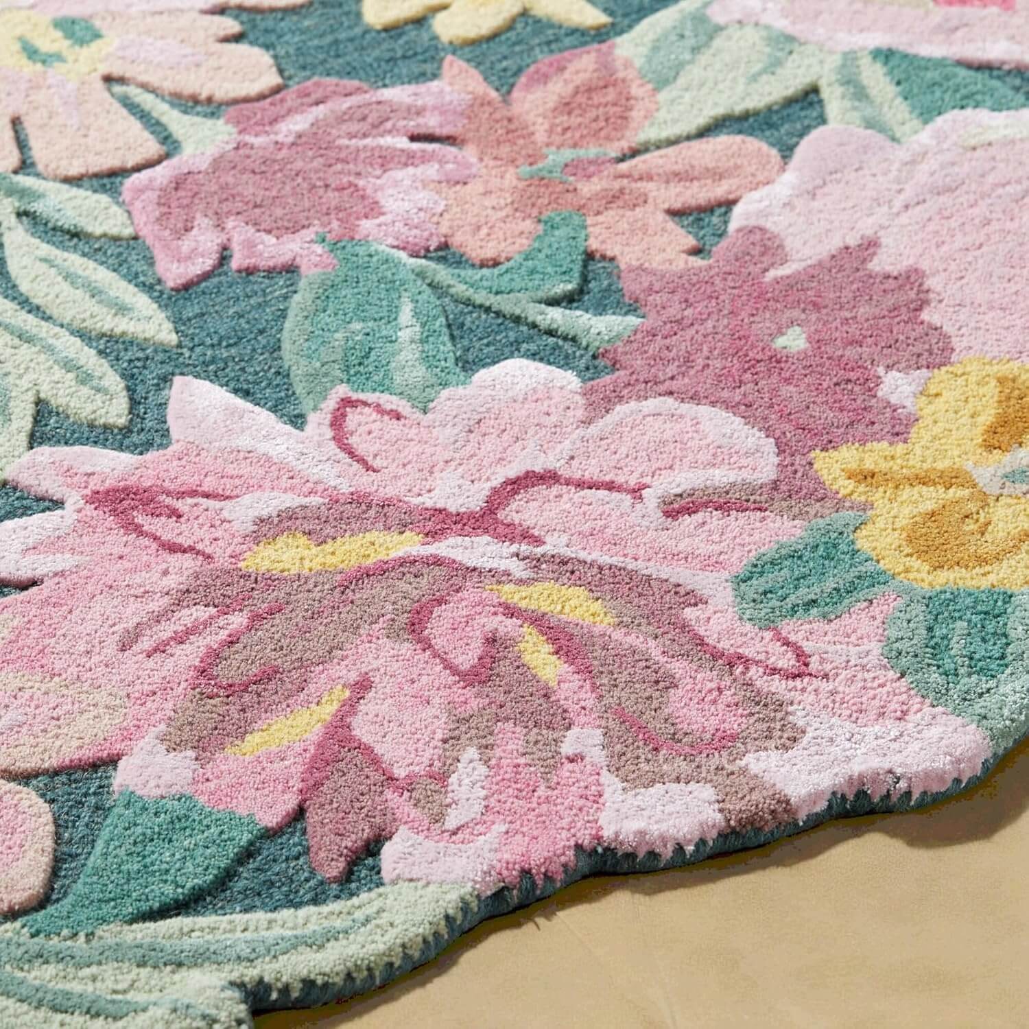 Close-up of Blossom Garden sculpted floral rug showcasing intricate flower and leaf patterns in vibrant colors.