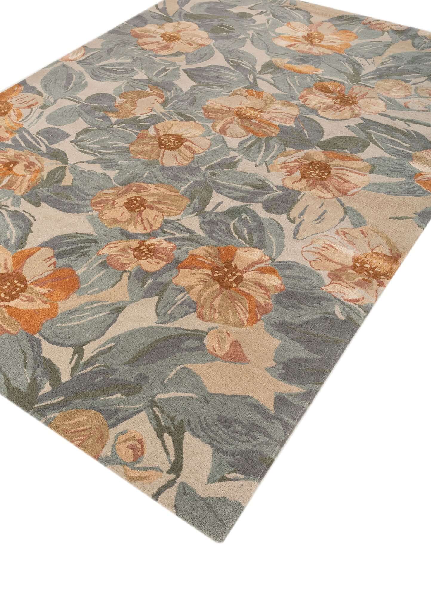 Blue haze hand-tufted rug with floral design in soft hues of blue and peach, perfect for modern home decor.