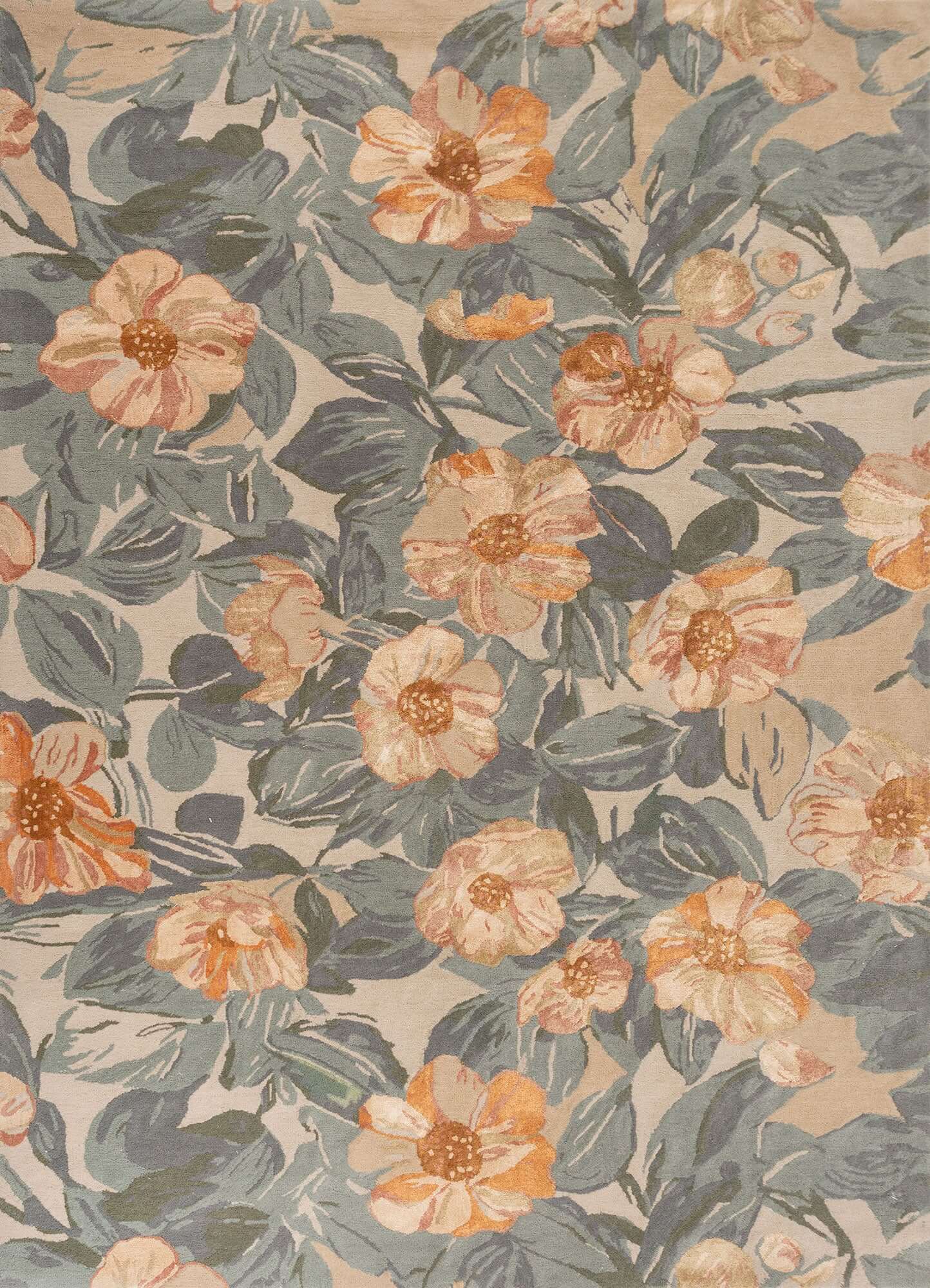 Hand-tufted blue haze rug with floral design in soft hues, adding elegance and sophistication to any space.