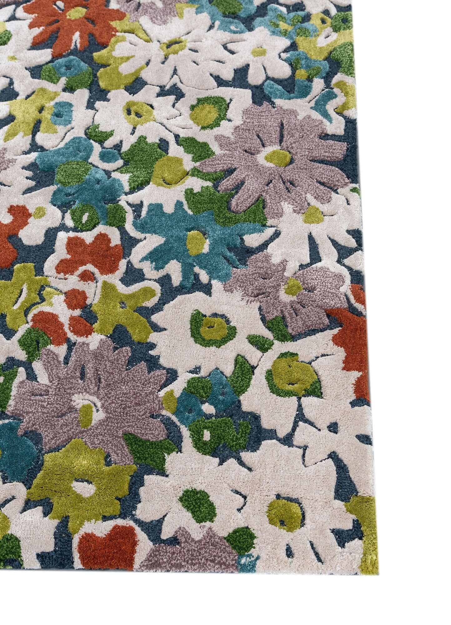 Indigo blue and white hand tufted rug with floral design in vibrant colors, adding elegance and comfort to any room.